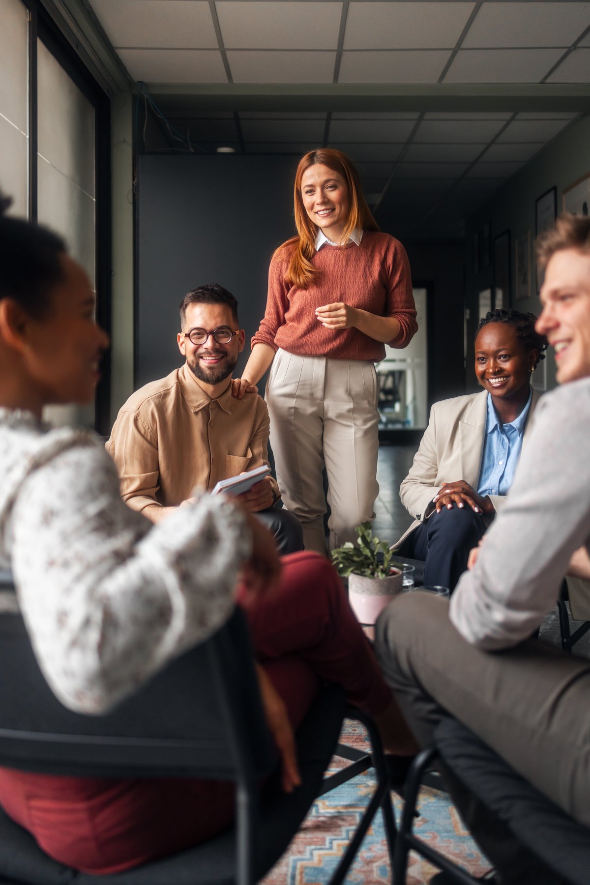Colleagues sharing ideas in a relaxed office setting